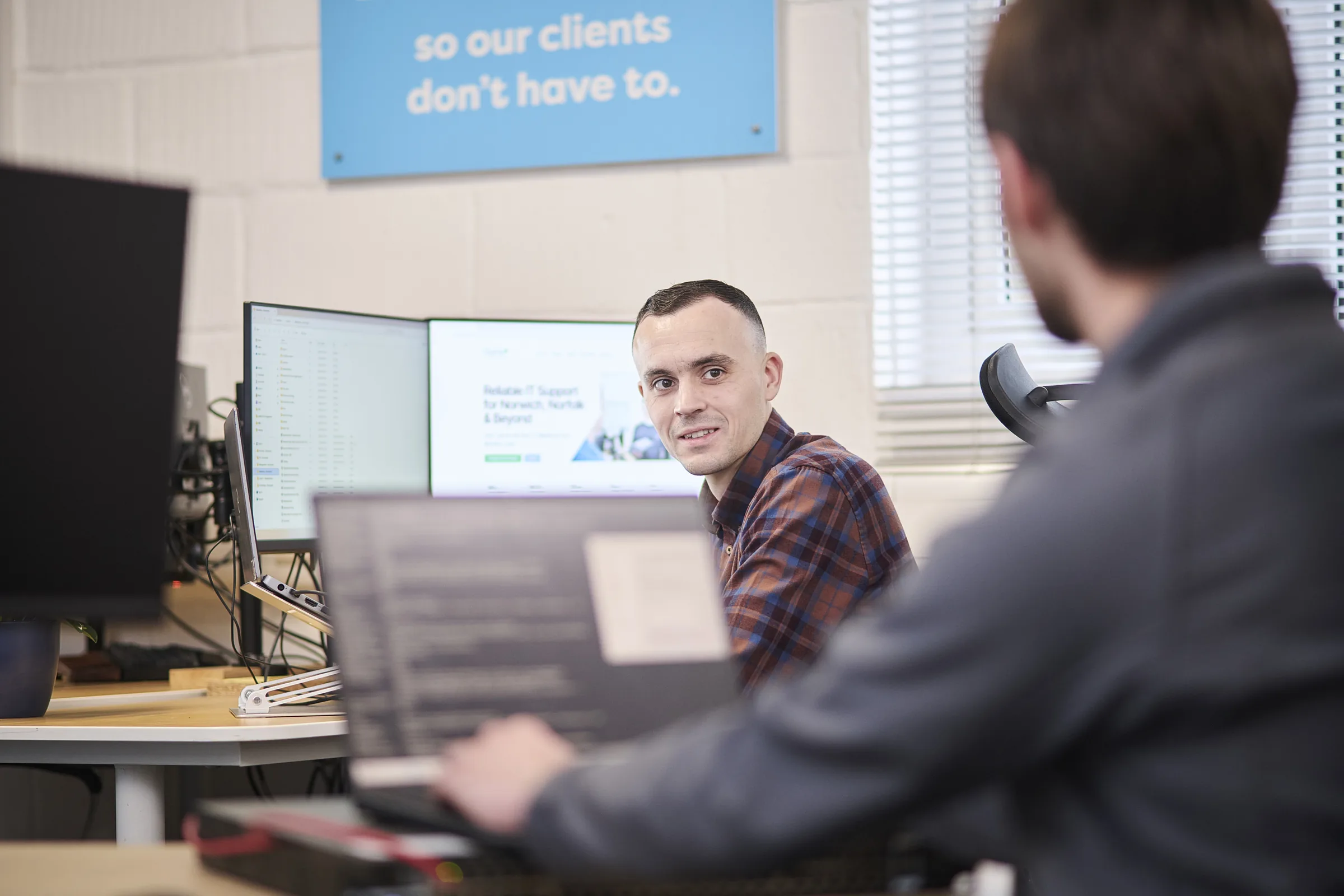 Senior Osiris consultant reviewing a multi-year charity technology plan with a client.