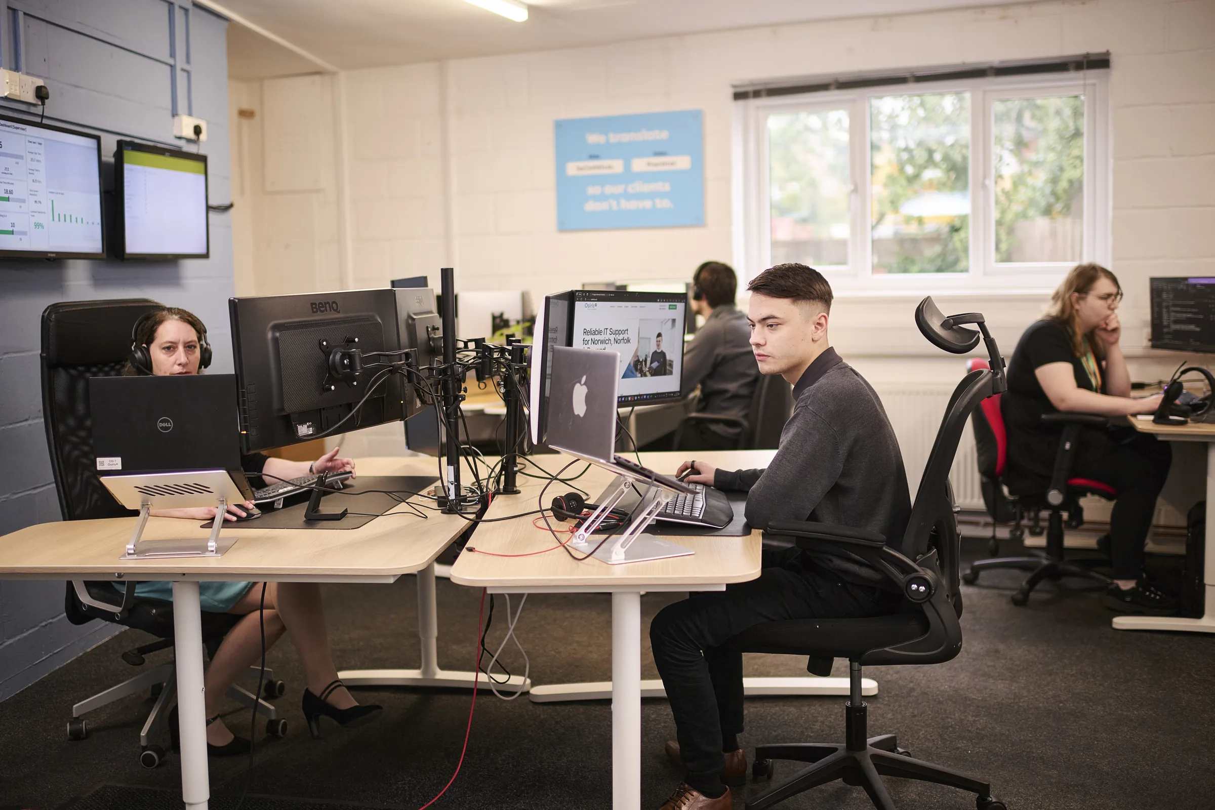 Osiris service desk team working across support workstations.
