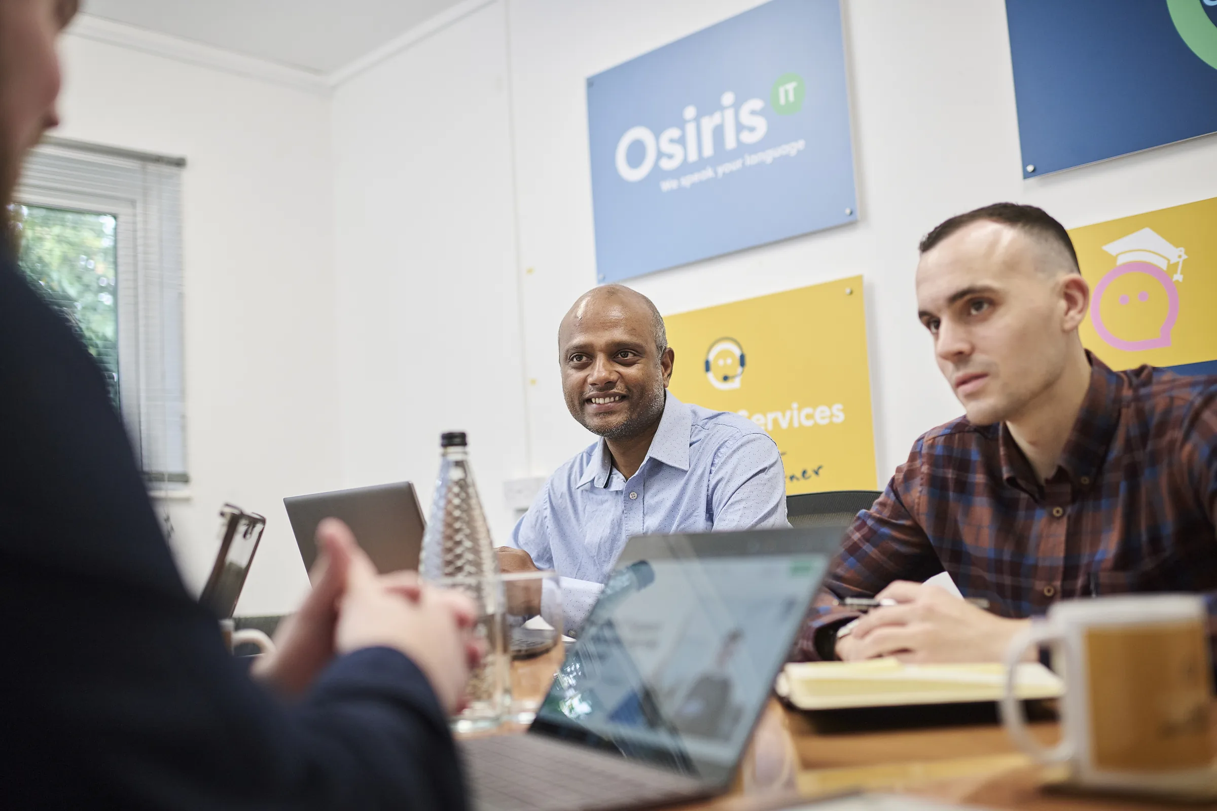Osiris consultants gathered around a meeting table for a board-level AI readiness workshop.