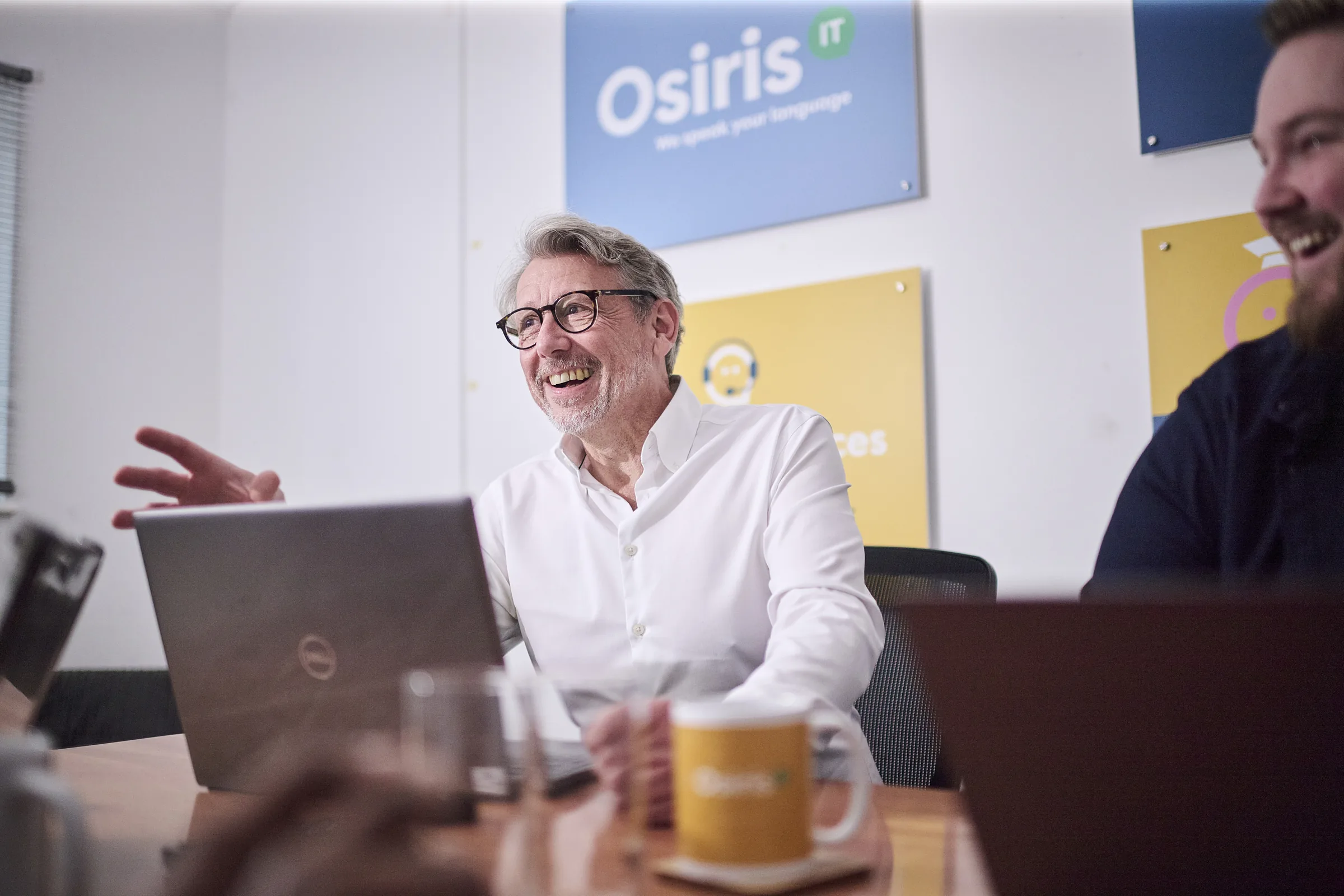 Senior Osiris consultants in a boardroom-style technology planning meeting.